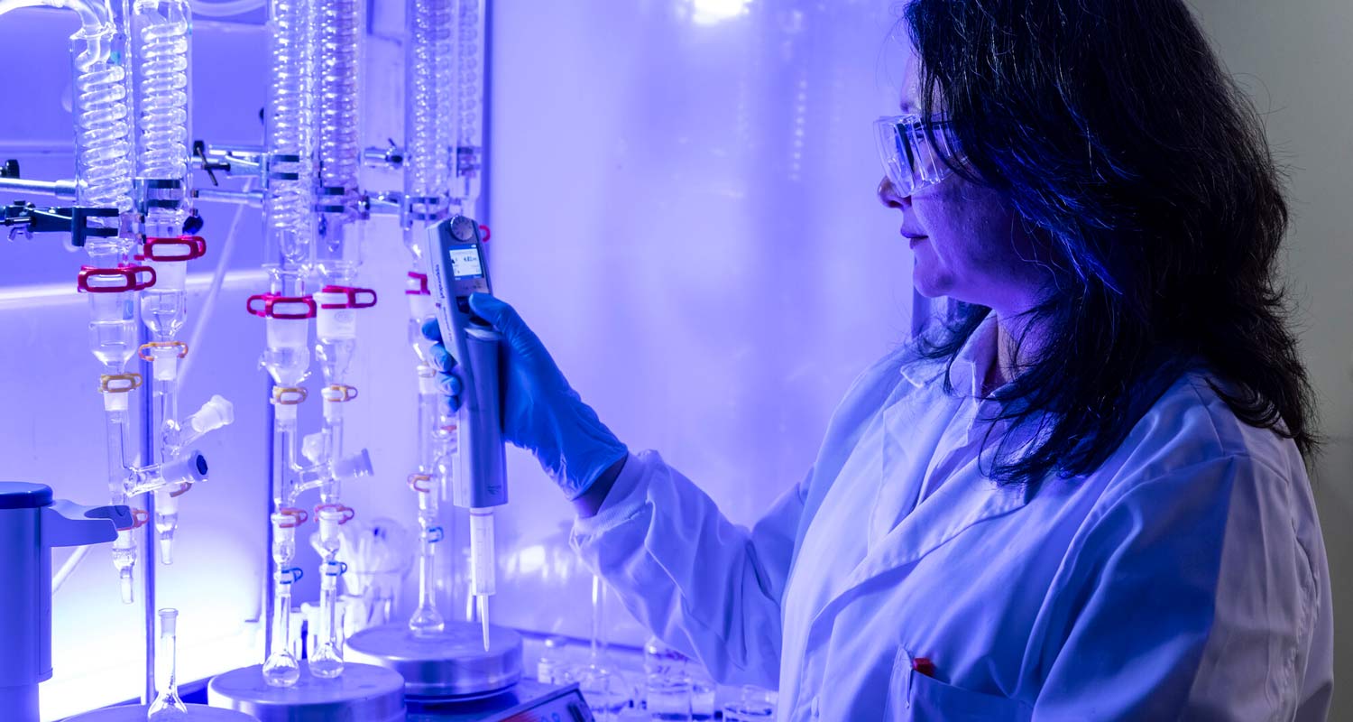 A researcher checks the contents of some test tubes