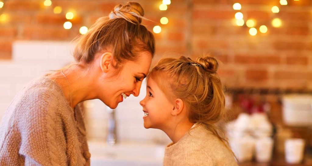 Mother and daughter hugging each other